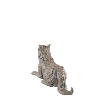 A sculpted wolf figurine rests on a dark surface, its back to the viewer, against a plain black background.