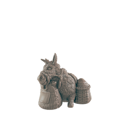 A donkey figurine carries sacks and a basket; it rests against a plain dark background.