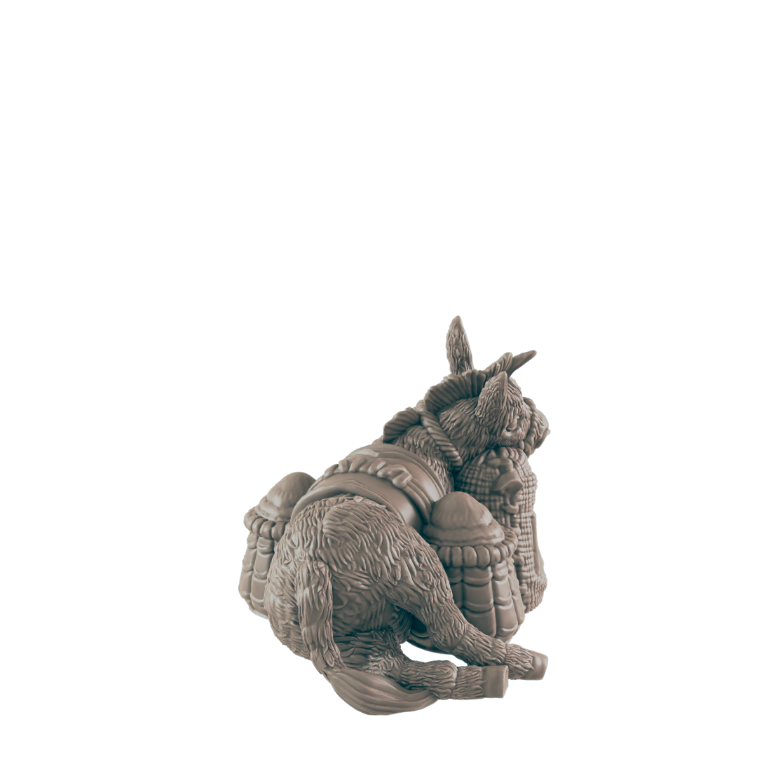 A donkey figurine rests on its haunches, burdened by several sacks, against a dark background.