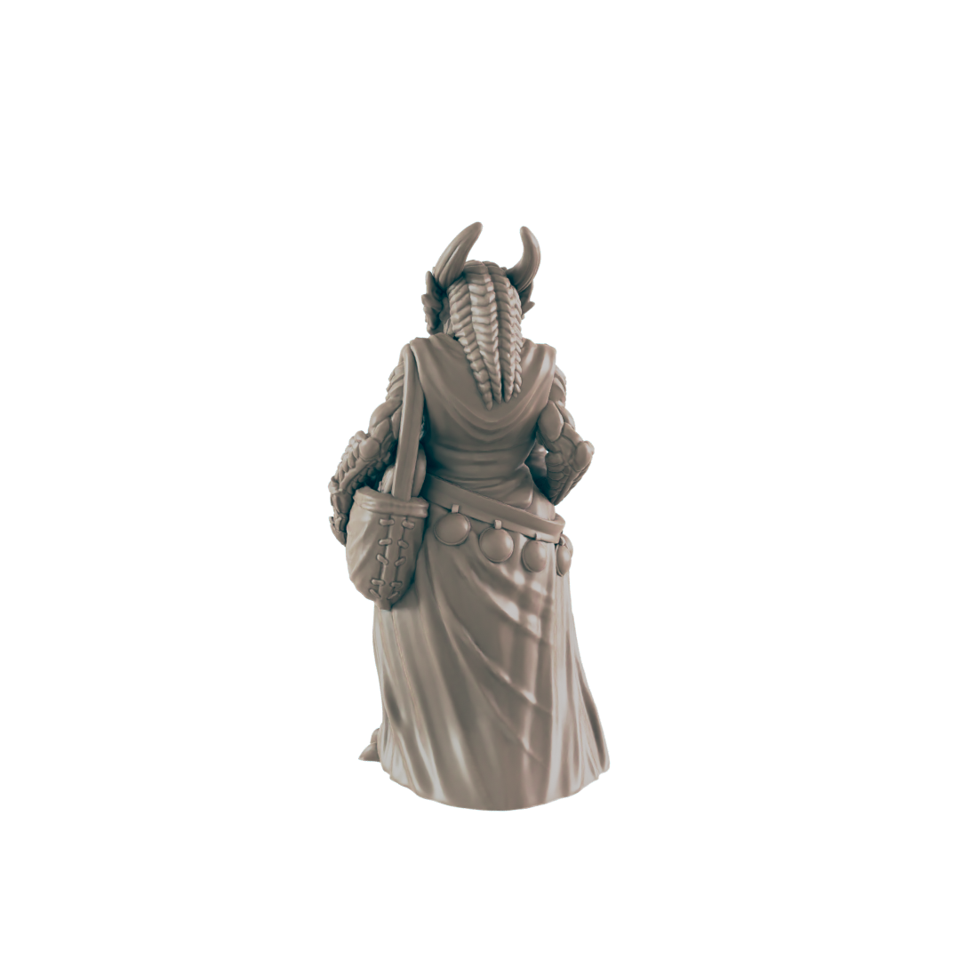 A miniature figurine of a horned, robed female figure stands with a satchel, viewed from behind against a dark background.
