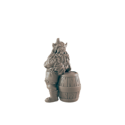 A miniature dwarf figure, dressed as a Viking, leans against a small barrel.  The scene is set against a plain dark background.