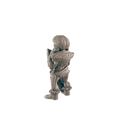 A miniature female figure, seemingly a warrior, stands facing away, holding a shield.  She is clad in fur and armor, set against a plain black background.