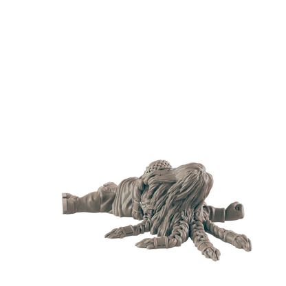 A miniature humanoid figure lies prone, its lower body transformed into a multi-legged octopus-like appendage, against a black background.