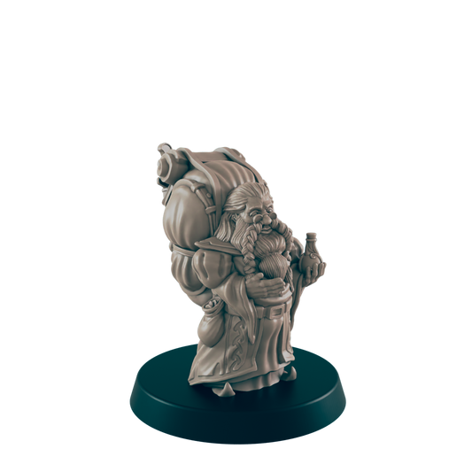 A dwarf miniature stands on a dark green platform. It wears a pack, and holds a bottle while wearing a long, decorative robe.