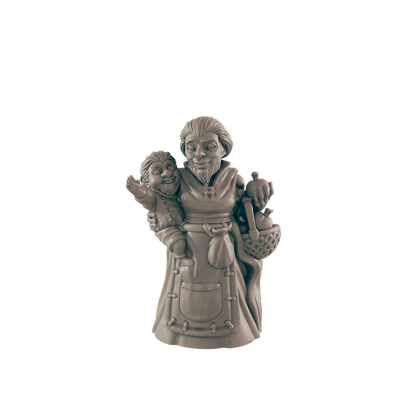 A female gnome figure cradles a small gnome child on her hip and has a basket of goods under her arm, standing in a simple setting.