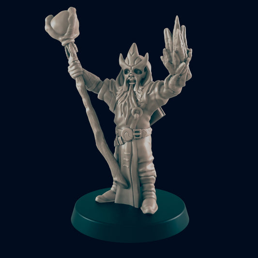 A miniature wizard figure, wielding a staff and casting a spell, stands on a circular base against a dark background.