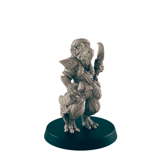 A miniature reptilian humanoid figure stands holding a curved blade, posed on a dark circular base against a dark background.