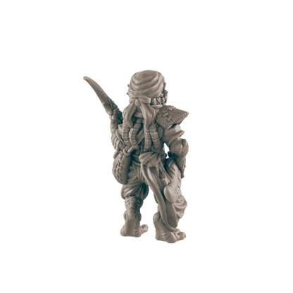 A miniature figurine of a warrior stands, seen from behind, holding a weapon; it is positioned against a black background.