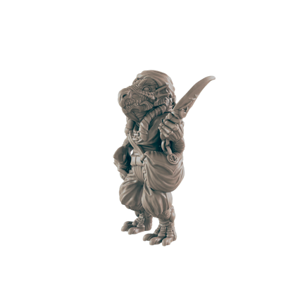 A miniature reptilian humanoid figure, stands holding a curved blade, against a dark background.