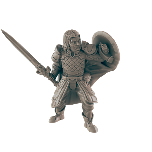 A monochrome, gray miniature warrior stands ready for battle, brandishing a sword in one hand and holding a shield in the other, against a black backdrop.
