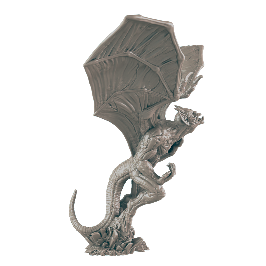 A gray, winged gargoyle miniature is perched on a rocky base.  It is posed in a dynamic, upward stance.