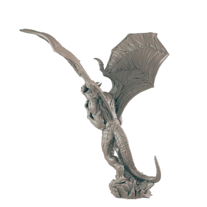 A dragon statue, posed mid-flight, stands on a rocky base against a dark background.