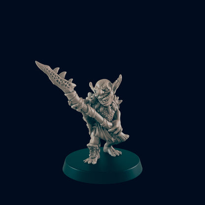 A gray goblin figure raises a spiked club overhead, its mouth open in a wide grin. The figure stands on a round gray base against a dark background.