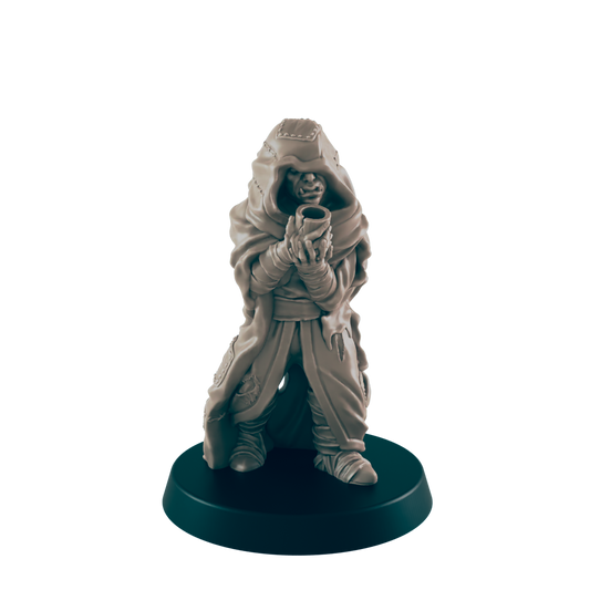 A miniature orc figure, cloaked and hooded, holds a small cup; it stands on a circular base against a dark background.