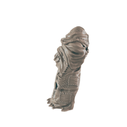 A sculpted fabric figure stands against a dark background.  The fabric is sewn together with visible stitching and patches.