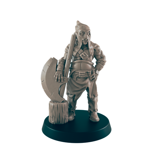 A miniature executioner stands, holding a large axe against a wood block.  He is clad in a hooded robe and belted tunic. The figure rests on a dark circular base.