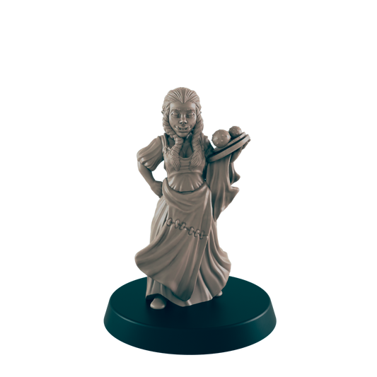 A miniature, light-brown female figure, dressed in peasant-style clothing, holds a tray of spherical objects. The figure stands on a black, circular base against a black backdrop.