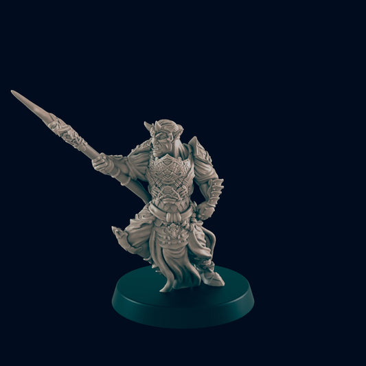 A miniature goblinoid figure wields a spear, poised dynamically against a dark backdrop.