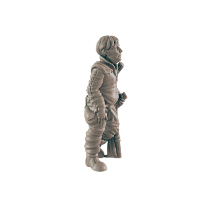 A miniature figurine of a stout, short person stands, holding a staff or broom, against a dark background.