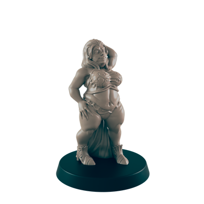 A plump female figurine stands, posing on a circular base.  She wears a two-piece outfit and boots. The setting appears to be a display or tabletop.