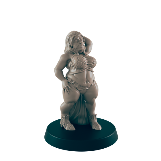 A plump female figurine stands, posing on a circular base.  She wears a two-piece outfit and boots. The setting appears to be a display or tabletop.