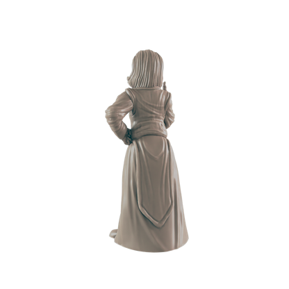 A miniature figurine, appearing female, stands with hands on hips, against a dark background.  The figure wears a long dress and jacket.