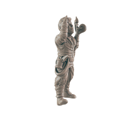 A miniature figurine of a stout, possibly dwarven, figure stands, holding a staff aloft.  It's wearing patched clothing and boots, against a plain background.