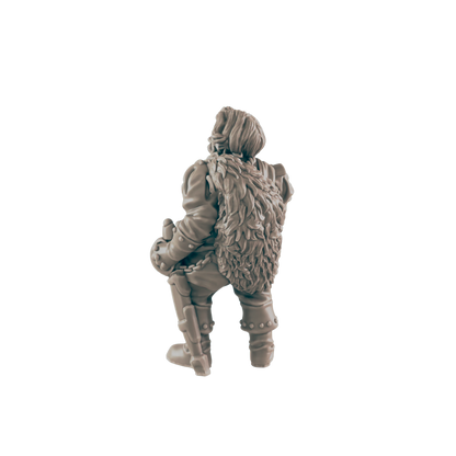 A miniature figurine of a stout, fur-clad figure sits, possibly a dwarf warrior, against a black background.
