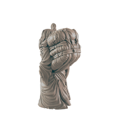 A sculpted figure, appearing to be a person, carries bundled sacks on its back. The figure is shown from behind, against a black background.