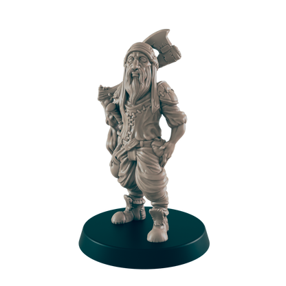 A miniature figurine of a bearded dwarf stands, carrying an axe, on a dark circular base.