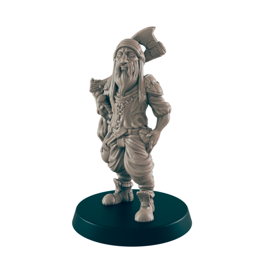 A miniature figurine of a bearded dwarf stands, carrying an axe, on a dark circular base.