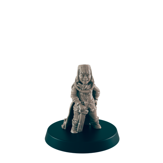 A miniature figurine of a young person, grinning and holding a sword, stands on a circular base against a black background.