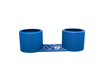 A blue dual cup holder sits on a surface.  The holder is connected by a patterned bridge.