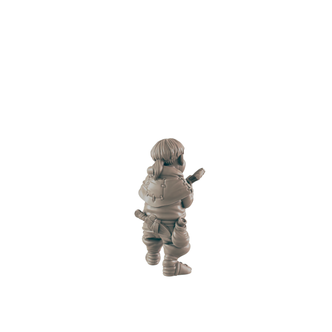 A small, grey figurine of a person, possibly a child, stands holding a weapon, set against a black background.