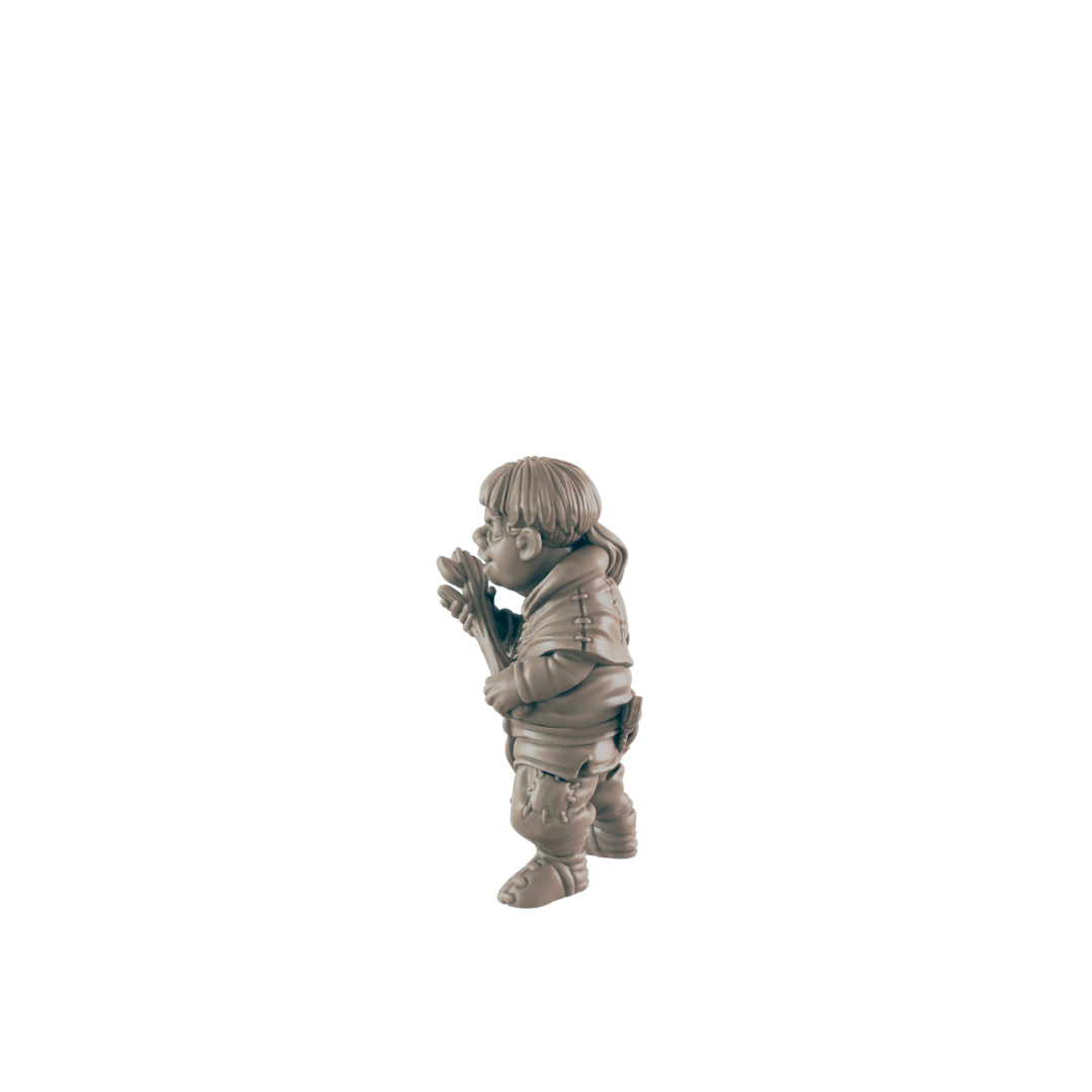 A small figurine of a gnome-like character holds a staff, standing against a dark background.