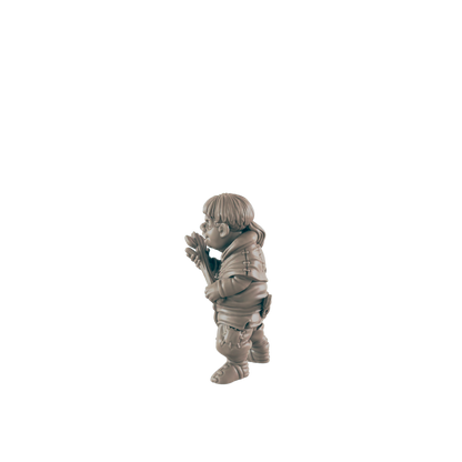 A small figurine of a gnome-like character holds a staff, standing against a dark background.