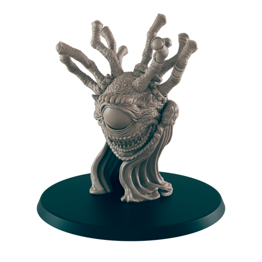 A monstrous beholder miniature sits atop a dark green base, its many eyestalks reaching upwards. The large central eye and rows of teeth are prominently displayed.