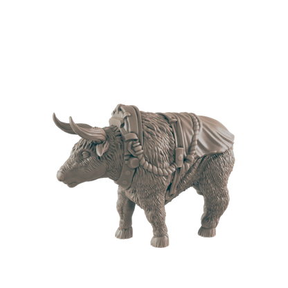 A yak figurine stands, wearing a harness; it is a miniature model against a black background.