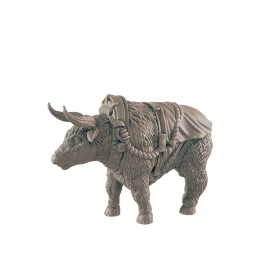 A yak figurine stands, wearing a harness; it is a miniature model against a black background.