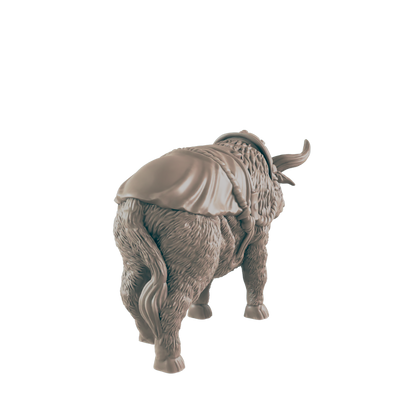 A yak figurine stands against a dark background.  It is facing away from the viewer, showing its furry rear and a draped saddle-like covering.