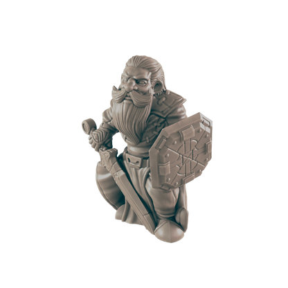 A miniature dwarf kneels, holding a sword and shield, with a long beard, and wearing armor. The background is black.