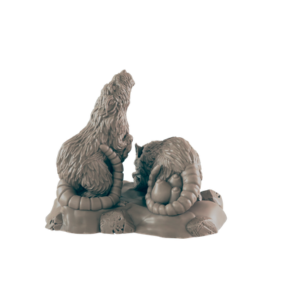 Two rat-like figures, sculpted in a seated position on a rocky base, interact. One appears to be observing the other, which holds a small, round object.