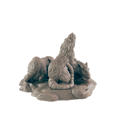 Three rats are sculpted, interacting on a small, textured base.  They appear to be huddling or fighting. The setting is implied to be a dark, rocky environment.