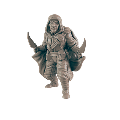 A rogue miniature stands, wielding two curved daggers. He wears a hooded cloak and utility belt against a solid black background.