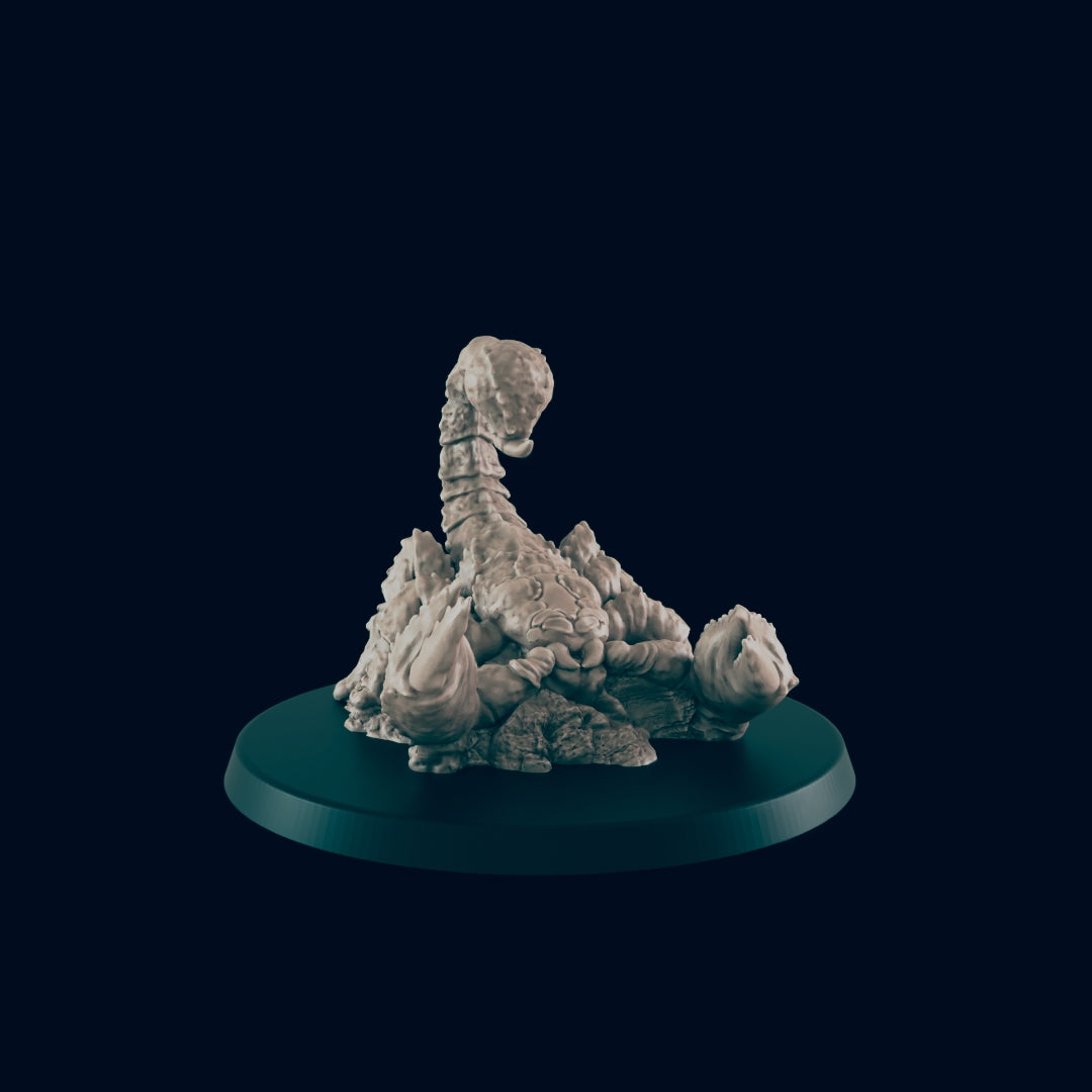 A sculpted scorpion rests on a dark circular base.  The scorpion is positioned on a rocky texture. The background is a dark, plain color.