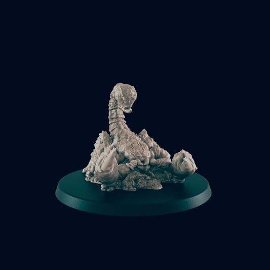 A sculpted scorpion rests on a dark circular base.  The scorpion is positioned on a rocky texture. The background is a dark, plain color.