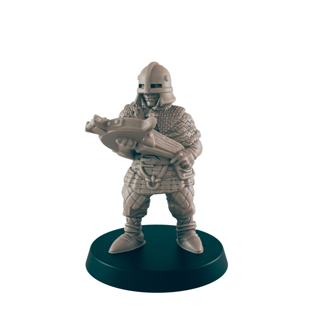 A miniature warrior wearing chainmail and a helmet holds a crossbow, standing firmly on a circular black base, all against a solid black background.