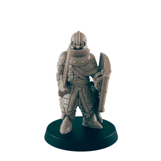 A knight figurine stands, equipped with sword and shield, on a round base, against a black background.