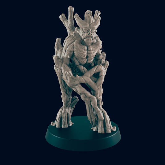 A tree-like creature stands on a dark circular base.  Its body is composed of intertwined branches and gnarled wood, suggesting a humanoid form. The background is a dark, featureless space.
