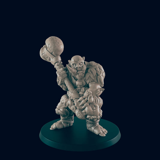 A miniature orc wields a spiked club, standing on a circular base against a dark background.